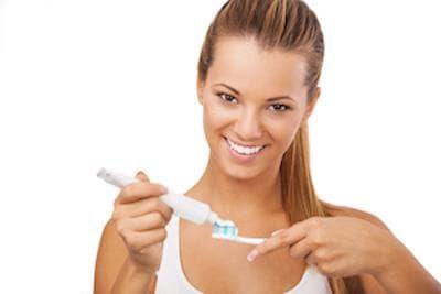 girl brushing her teeth in wilmington 